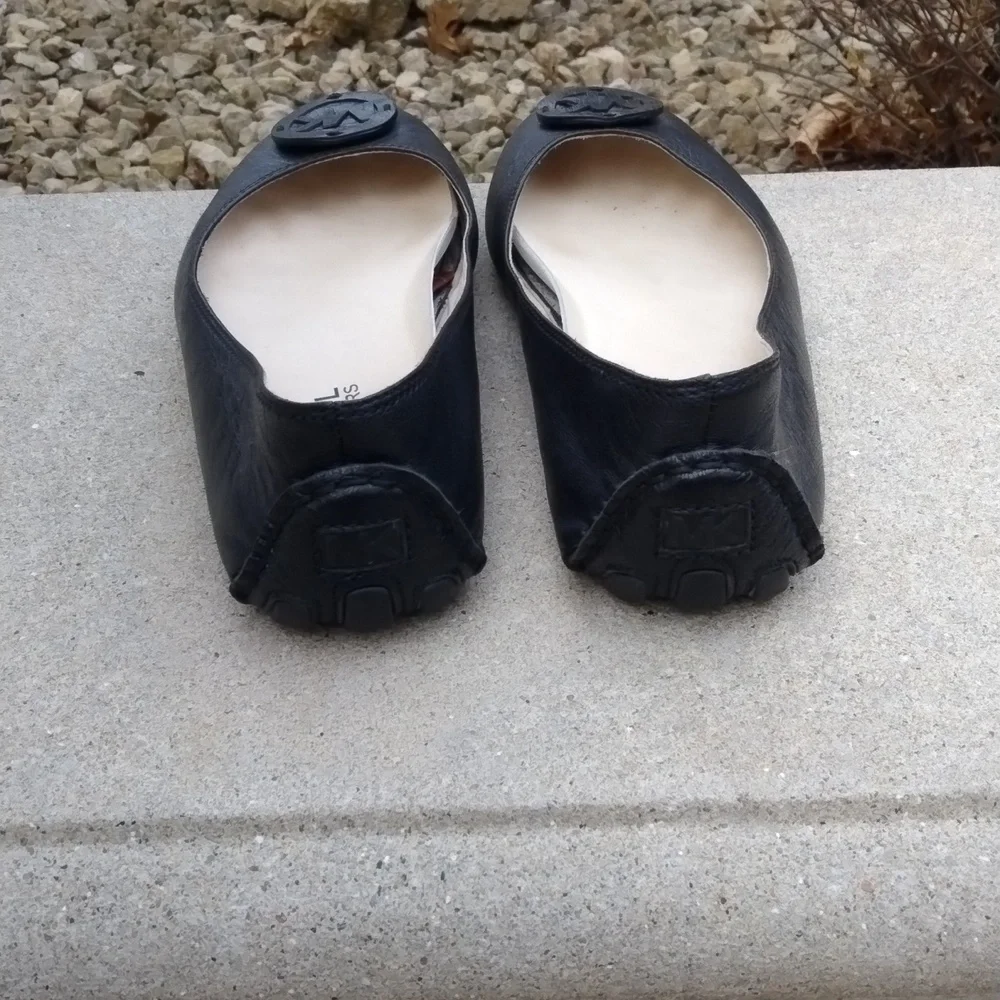 Michael Kors black leather flats with MK logo. Size 7.5